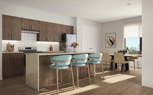 A modern kitchen with a bar area and chairs.