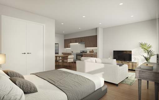 A modern bedroom with a large bed and a television in the corner.
