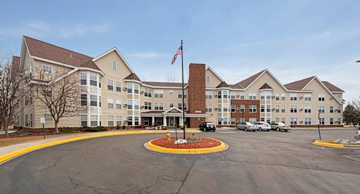 A large building with a flag on top of a pole.