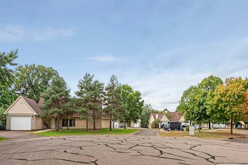 A residential area with houses and trees.