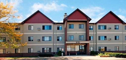 A large apartment building with the number 8151 on the front.