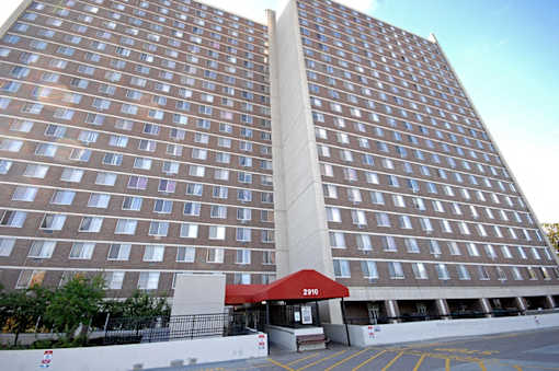A large building with a red awning and the number 2010 on it.