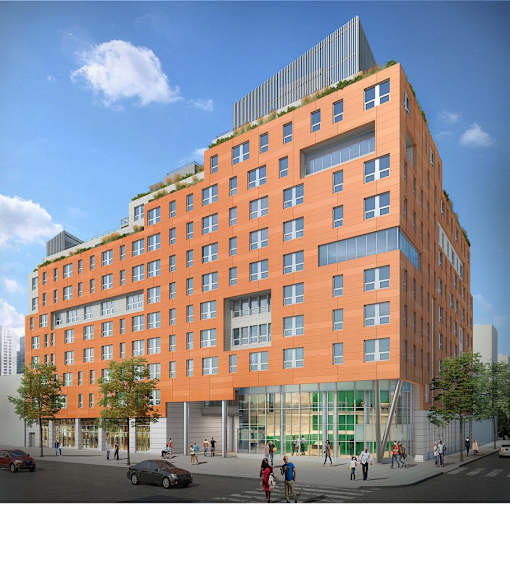 A modern orange building with a green roof and a glass facade.