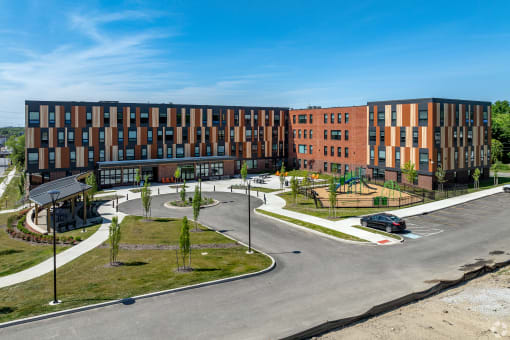 an aerial view of a building with a parking lot