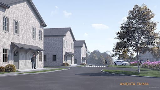 A residential street with houses on both sides and a car parked on the right.
