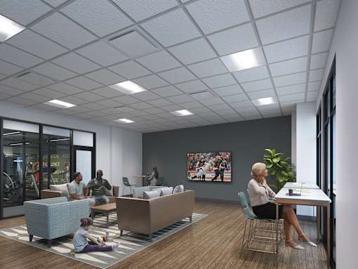 A group of people are sitting in a modern office space.