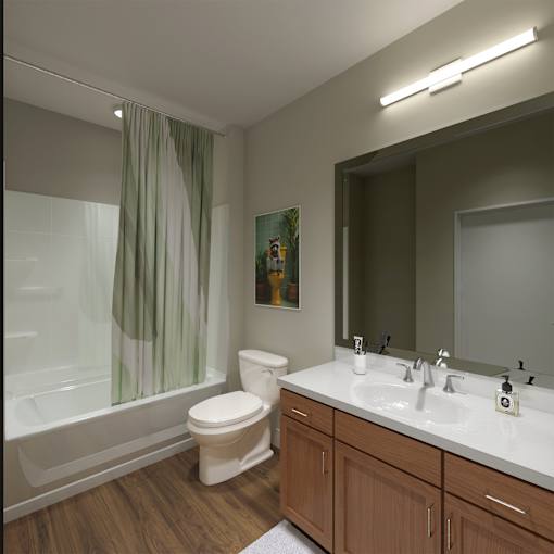 A white toilet sits in a bathroom next to a sink and a bathtub.