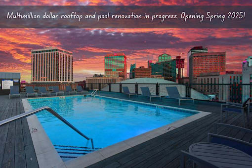 A pool area with a caption about a multimillion dollar renovation opening in spring 2025.