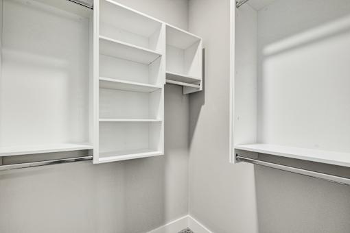 Empty white shelves in a room at The Ashton at East Park Apartments, Kennesaw, 30144