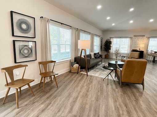 A living room with wooden floors and furniture at Emery Village, Concord, NC