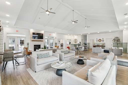 Clubhouse interior with couches and chairs and a fireplace at The Parker North Augusta, North Augusta, South Carolina, 29841