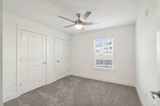 A room with a ceiling fan at The Parker North Augusta, North Augusta, SC, 29841