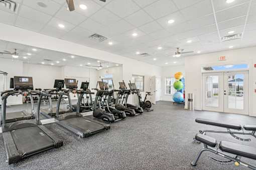 A gym with treadmills and exercise equipment at The Parker North Augusta, North Augusta, South Carolina, 29841