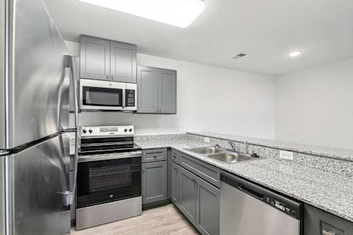 A modern kitchen with stainless steel appliances at The Parker North Augusta, North Augusta, SC, 29841