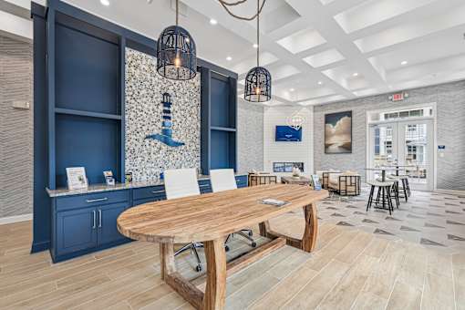 A modern dining area with a wooden table and chairs.