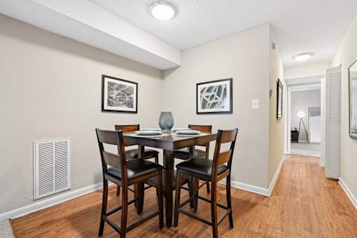 Dining area with high top table and chairs at The Palms Apartments, Charleston, SC