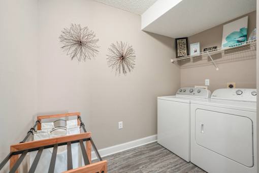 White washer and dryer in a laundry room with a white dryer  at Cape Landing, Myrtle Beach, SC