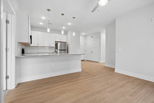 Open concept living and kitchen with granite countertops at The Palms Apartments, South Carolina, 29407