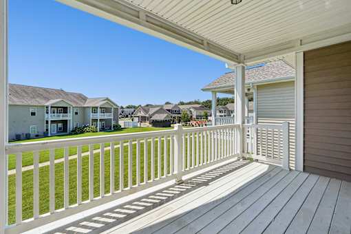 Covered balcony overlooking residential neighborhood at The Lory of Greenway Village Apartments, Kentucky