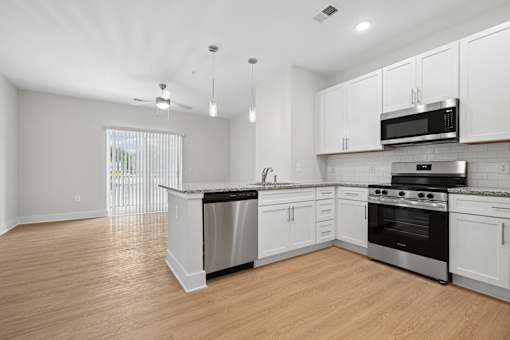 Open concept kitchen with granite countertops at The Palms Apartments, Charleston, SC