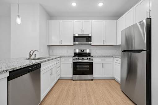 Updated kitchen with granite counters and stainless appliances at The Palms Apartments, Charleston, South Carolina