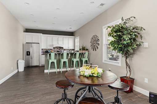 Open kitchen with breakfast bar and mint green stools at The Lory of Greenway Village Apartments, Kentucky, 42001