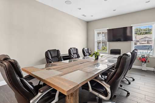 Conference room with wood table and executive chairs at The Lory of Greenway Village Apartments, Kentucky, Kentucky