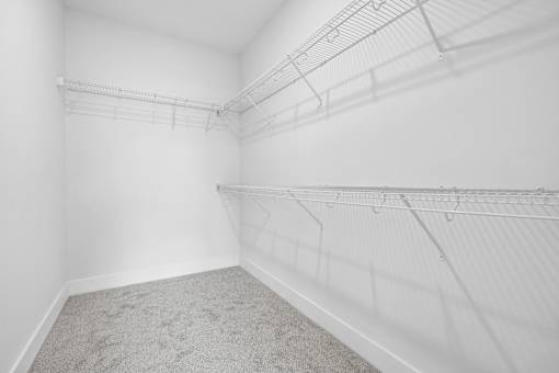 Walk-in closet with wire shelving at The Palms Apartments, Charleston