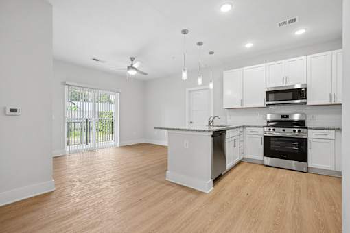 Bright open floor plan with pendant lighting at The Palms Apartments, South Carolina, 29407