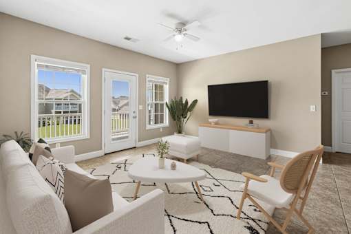 Living room with modern furniture and wall mounted tv at The Lory of Greenway Village Apartments, Kentucky