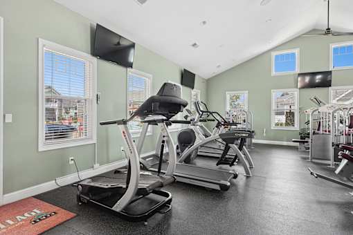 Fitness center with cardio machines and tvs at The Lory of Greenway Village Apartments, Kentucky, KY