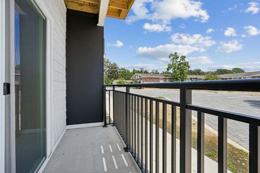 Second floor balcony overlooking parking area at The Palms Apartments, South Carolina