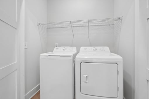 Inunit laundry with top load washer and dryer at The Palms Apartments, Charleston, SC