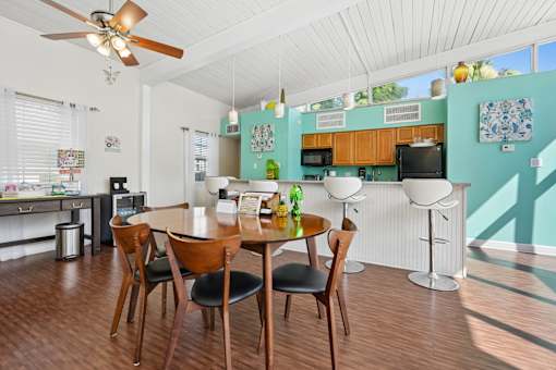 Open dining area with kitchen bar seating at The Palms Apartments, Charleston, SC 29407