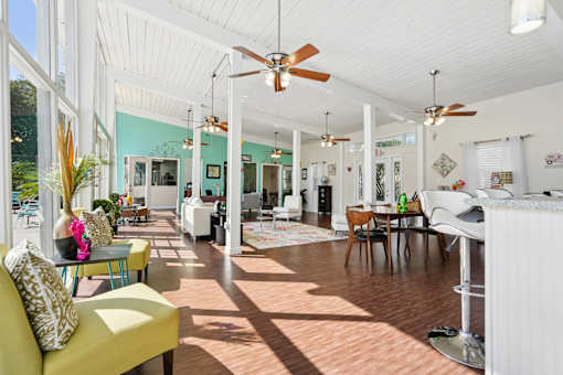 Bright open concept living space with wood floors at The Palms Apartments, Charleston, South Carolina