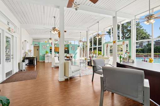Spacious clubhouse lounge with floor to ceiling windows at The Palms Apartments, Charleston, 29407