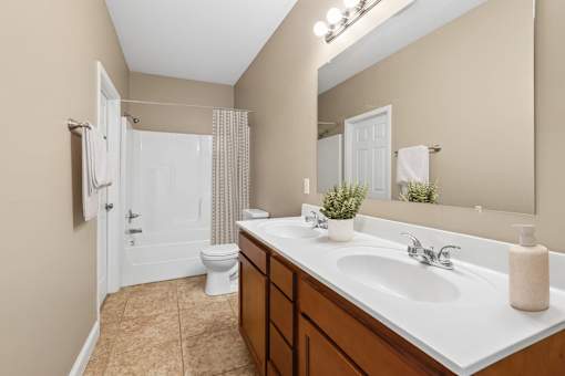 Bathroom with dual sinks and garden tub at The Lory of Greenway Village Apartments, Kentucky