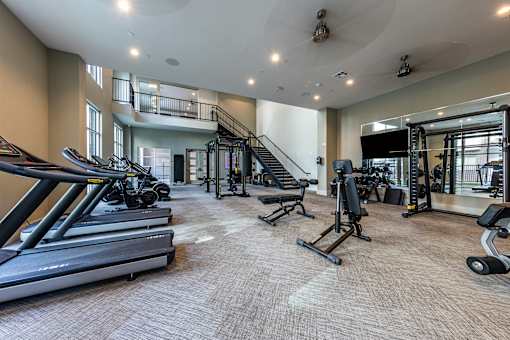 Gym with equipment at The Monroe Apartments, Austin, TX, 78741