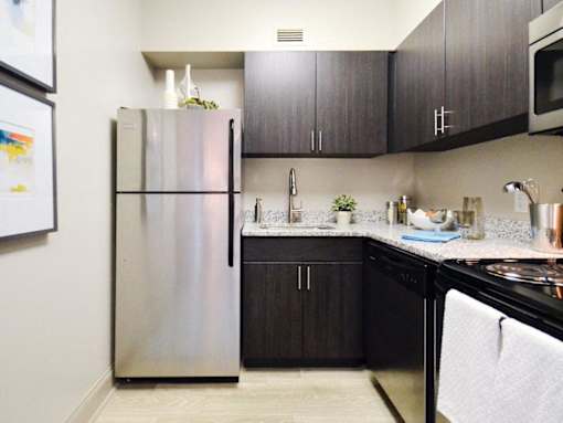 Kitchen with appliances at 500 Fifth Apartments, Tennessee