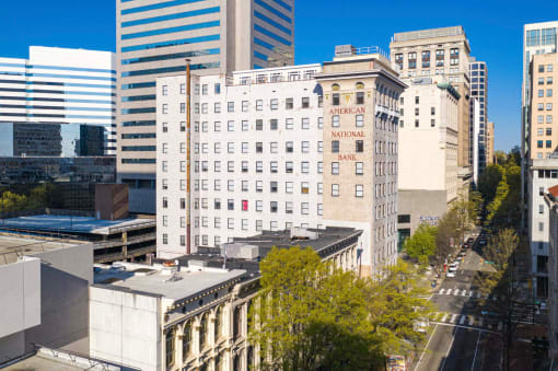 an aerial view of a white building in the city