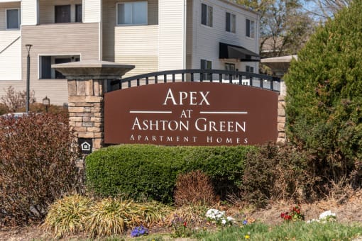 a sign for apex at ashton green apartment homes