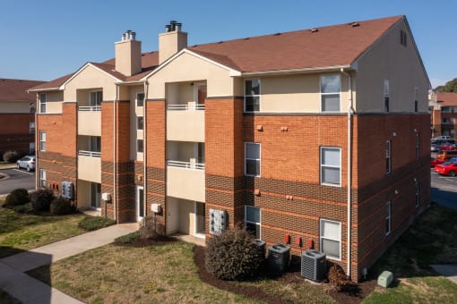 an exterior view of a brick apartment building