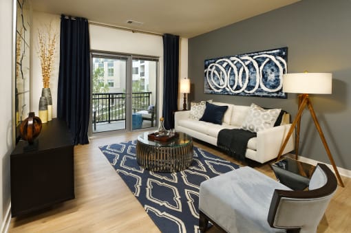 a living room with a white couch and a rug
