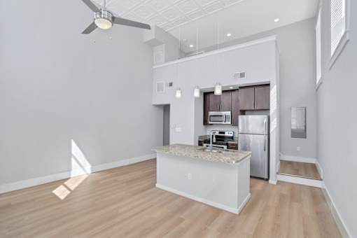 a kitchen with a counter top and a refrigerator