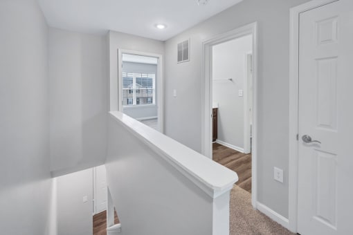 a bedroom with a medium sized bed and a window in a house