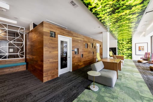 a rendering of a lobby with a green mural on the ceiling