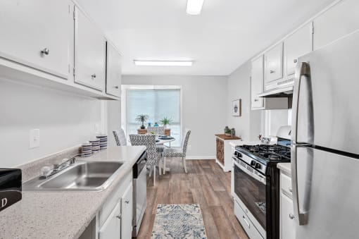 a kitchen and dining area in a 555 waverly unit