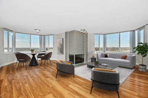 Expansive living room with fireplace and city views
