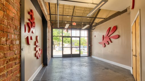 an empty room with graffiti on the wall and a doorway
