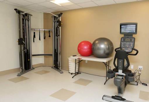 a gym with a ball and other equipment in a treatment room